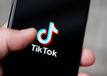 The TikTok logo is seen on an iPhone 11 Pro max in this photo illustration in Warsaw, Poland on September 29, 2020. The TikTok app will be banned from US app stores from Sunday unless president Donald Trump approves a last-minute deal between US tech firm Oracle and TikTok owner ByteDance. US authorities say the Chinese video sharing app threaten national security and could pass on user data to China. (Photo by Jaap Arriens/NurPhoto via Getty Images)